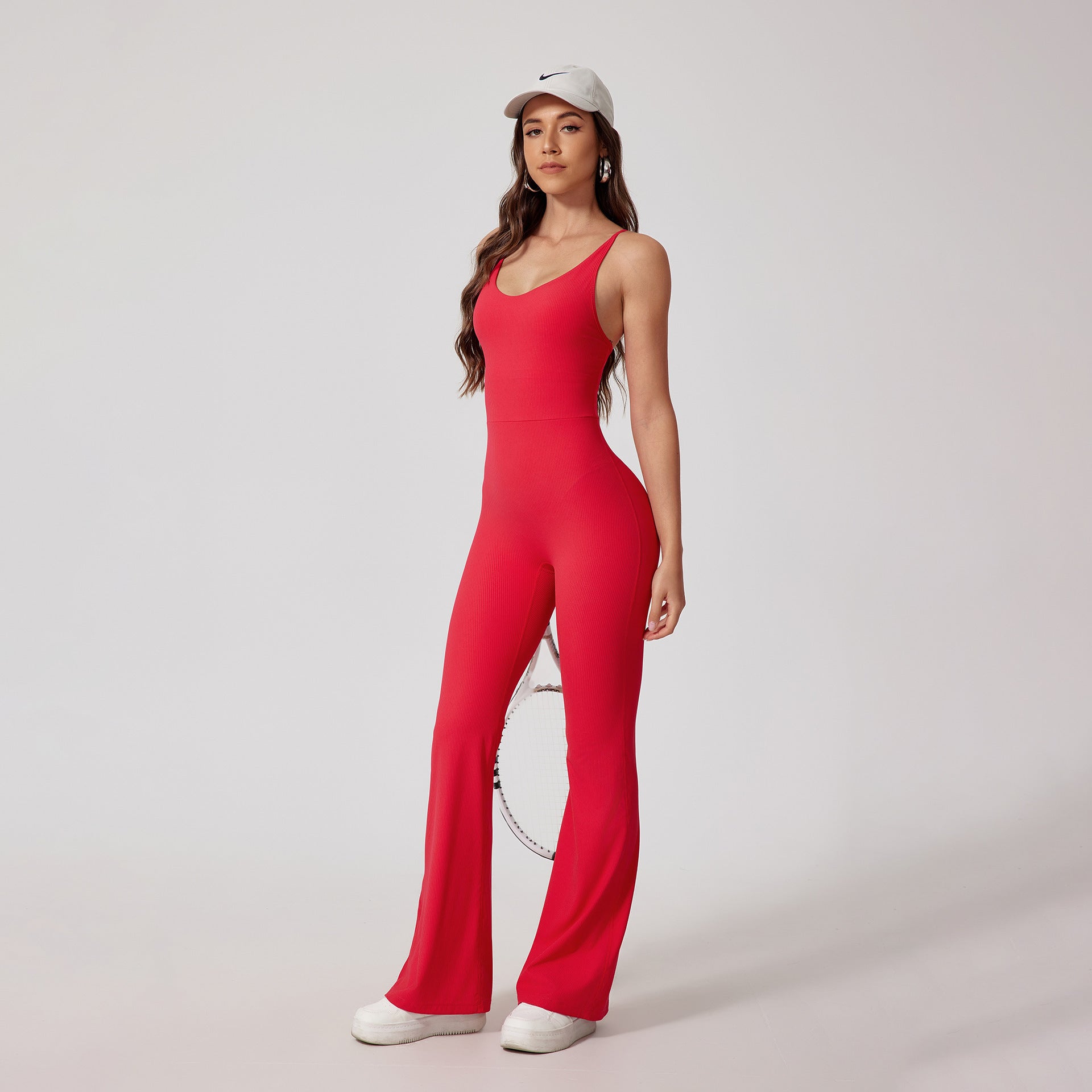 Strappy Open-Back Sports Jumpsuit — Flared Leg & Sculpting Fit